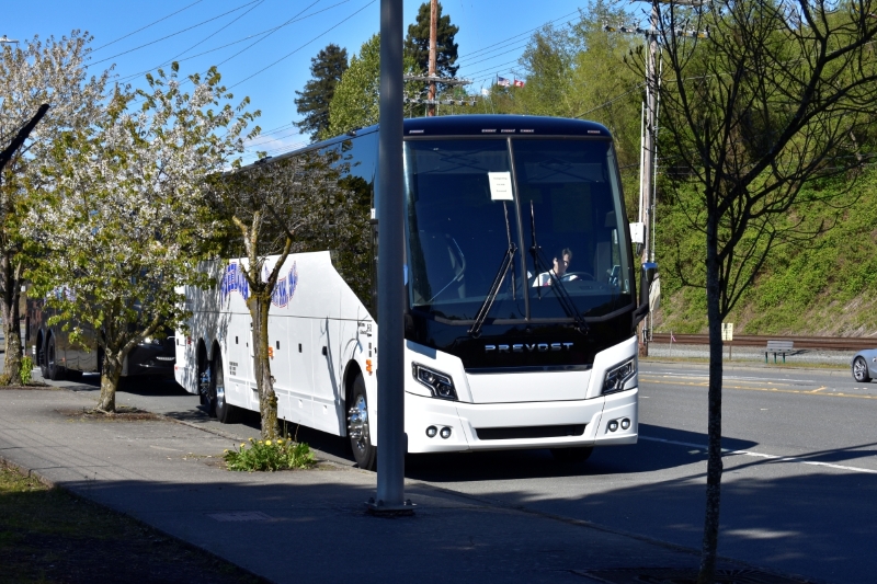School group boarding a charter bus